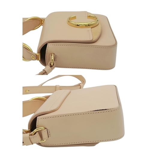 476 - A Chloé Pink C Crossbody Bag. Pink calf leather exterior with a beige suede panel near the gold-tone... 