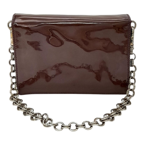 490 - A Prada Vernice Sound Bag. Glossy brown leather exterior, silver-tone hardware, features a detachabl... 