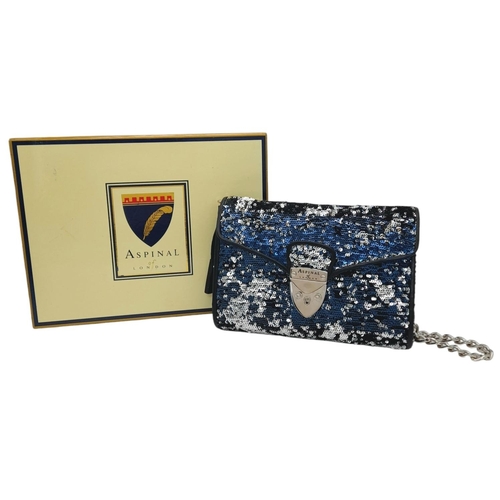 539 - An Aspinal of London Blue and Silver Sequinned Shoulder Bag. Sequinned exterior with black leather t... 