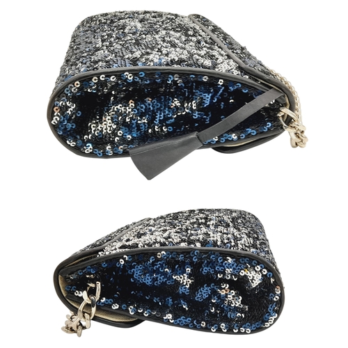 539 - An Aspinal of London Blue and Silver Sequinned Shoulder Bag. Sequinned exterior with black leather t... 