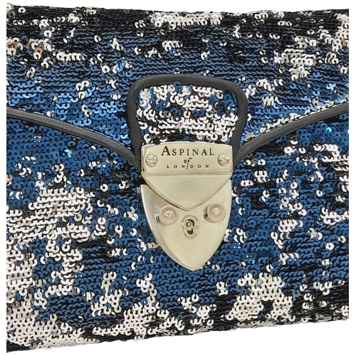 539 - An Aspinal of London Blue and Silver Sequinned Shoulder Bag. Sequinned exterior with black leather t... 