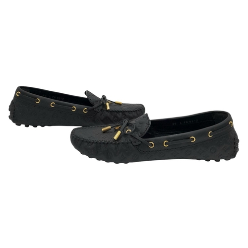 559 - A pair of Louis Vuitton Empreinte Gloria Loafers. Made from black leather with embossed LV monogram,... 