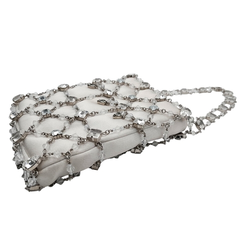 566 - A Swarovski Decorative Crystal Evening Bag. 17cm x 11cm. Comes with original packaging. Ref: 18534