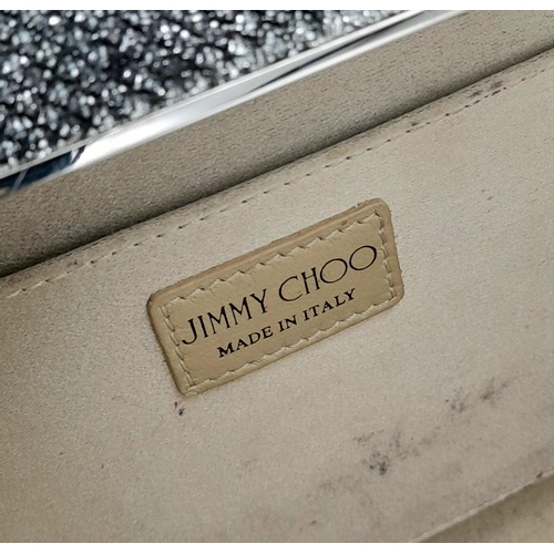 594 - A Jimmy Choo Glitter Clutch Bag. Black glitter exterior with silver-toned hardware, engraved Jimmy C... 