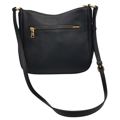 622 - A Coach Black Chaise Crossbody Bag. Pebbled leather exterior with gold-toned hardware, adjustable st... 