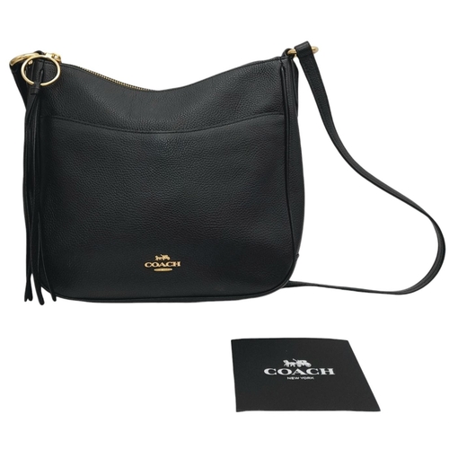 622 - A Coach Black Chaise Crossbody Bag. Pebbled leather exterior with gold-toned hardware, adjustable st... 