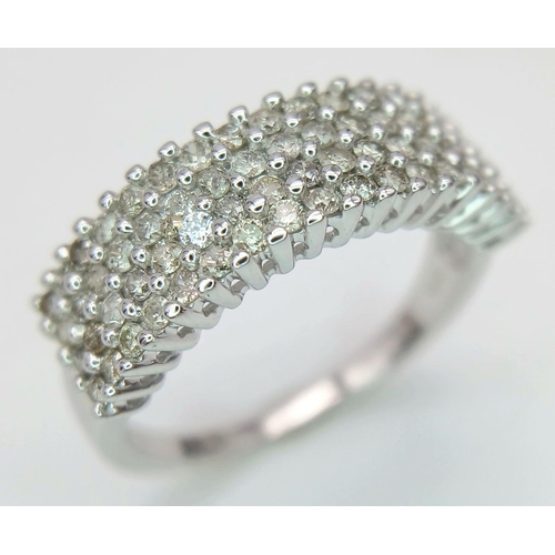 703 - A 9K White Gold Diamond Four Row Ring. 0.75ctw of diamonds. Size O. 3.7g total weight.