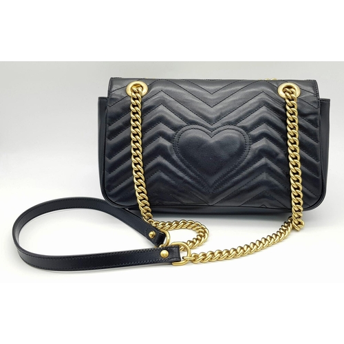 720 - A Gucci Black Marmont Matelassé Bag. Black quilted leather exterior with gold-toned hardware, chain ... 