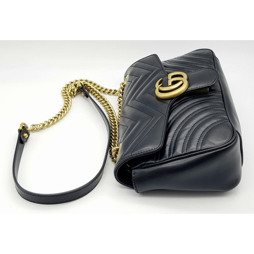 720 - A Gucci Black Marmont Matelassé Bag. Black quilted leather exterior with gold-toned hardware, chain ... 