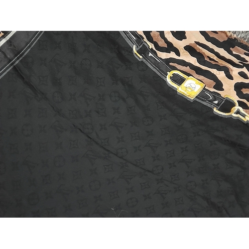 755 - A Louis Vuitton Silk Wool Leopard Monogram Scarf. Featuring the LV monogram pattern bordering the fa... 