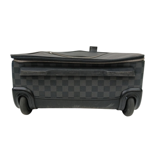 769 - A Louis Vuitton Damier Graphite Pegase Suitcase. Coated canvas exterior with leather trim, ID tag an... 