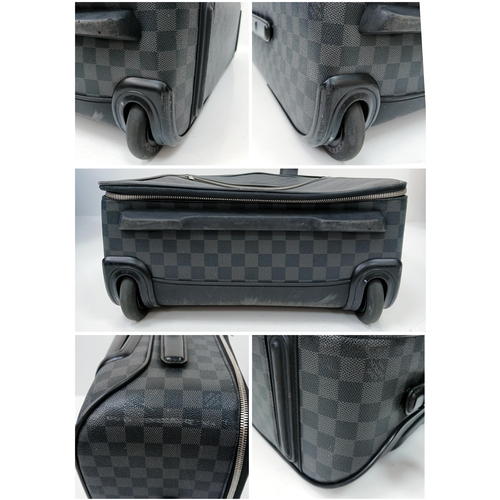 769 - A Louis Vuitton Damier Graphite Pegase Suitcase. Coated canvas exterior with leather trim, ID tag an... 