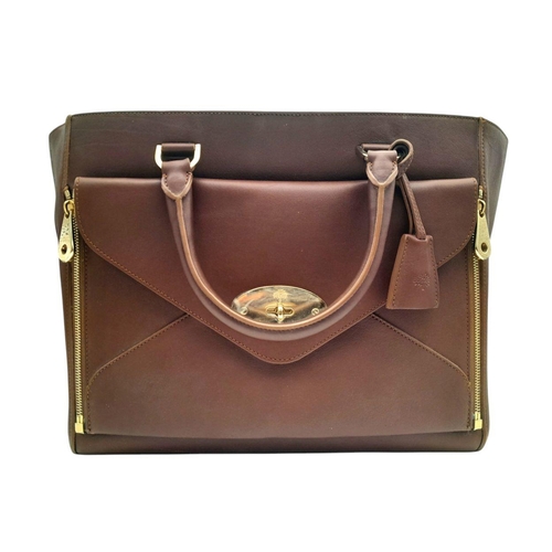 812 - A Mulberry Willow Tote Bag. Brown leather exterior with silver-toned hardware, magnetic top closure,... 