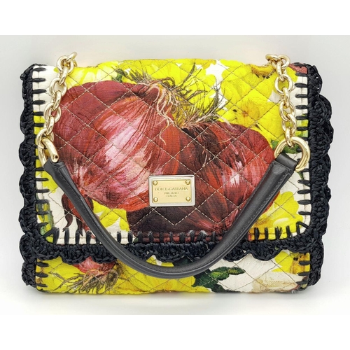 917 - A Dolce & Gabbana Quilted Printed Shoulder Bag. Multicoloured quilted fabric exterior features a vib... 