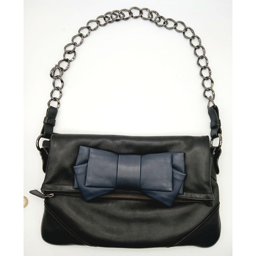 924 - A Tara Jarmon Black and Blue Bow Bag. Leather exterior with chrome-toned hardware, chunky chain stra... 