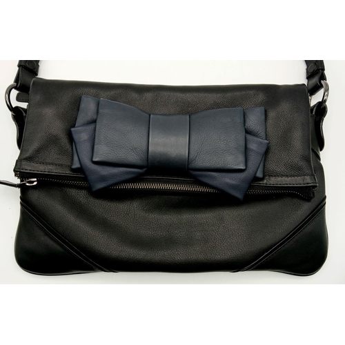 924 - A Tara Jarmon Black and Blue Bow Bag. Leather exterior with chrome-toned hardware, chunky chain stra... 