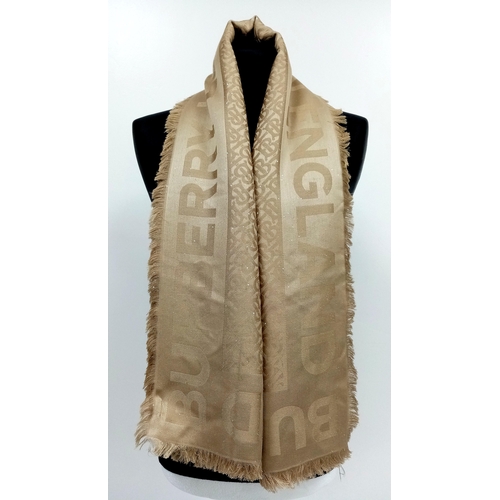 931 - A Burberry Khaki Silk and Sequin Scarf. 140cm x 140cm. In good condition but please see photos or re... 