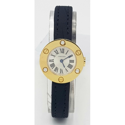 137 - A Cartier Leve 18K Gold Cased and Diamond Watch. Black leather strap. 18K gold case with 3 diamond b... 