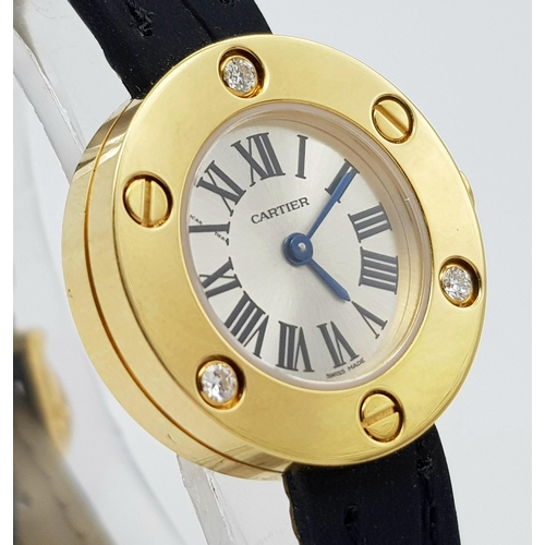 137 - A Cartier Leve 18K Gold Cased and Diamond Watch. Black leather strap. 18K gold case with 3 diamond b... 