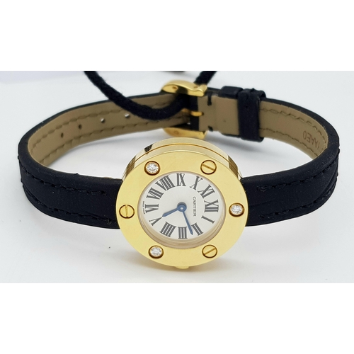 137 - A Cartier Leve 18K Gold Cased and Diamond Watch. Black leather strap. 18K gold case with 3 diamond b... 