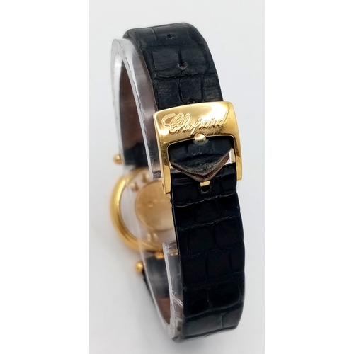 184 - A Chopard Happy Diamonds 18K Gold Quartz Ladies Watch. Black leather strap. 18K gold case - 26mm. Wh... 