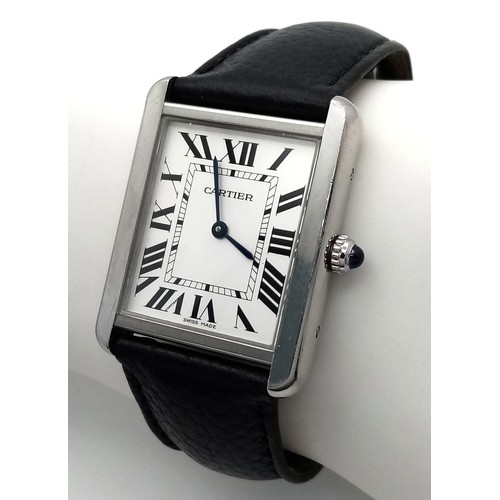 395 - A Cartier Tank Quartz Gents Watch. Black leather strap. Stainless steel case - 28mm. White dial with... 