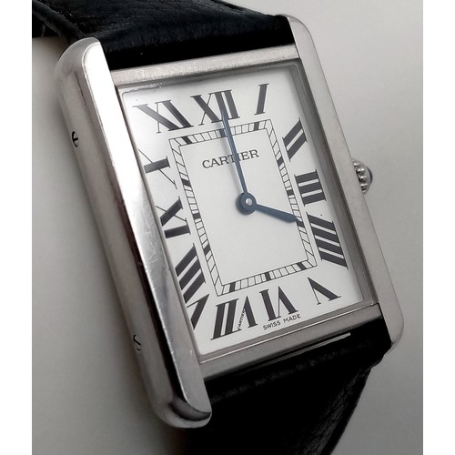 395 - A Cartier Tank Quartz Gents Watch. Black leather strap. Stainless steel case - 28mm. White dial with... 