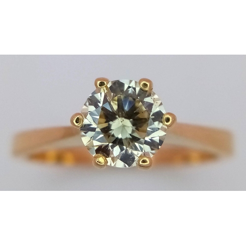 471 - An 18K Yellow Gold Diamond Solitaire Ring. A 0.75ct brilliant round cut diamond - SI1 clarity. Tinte... 