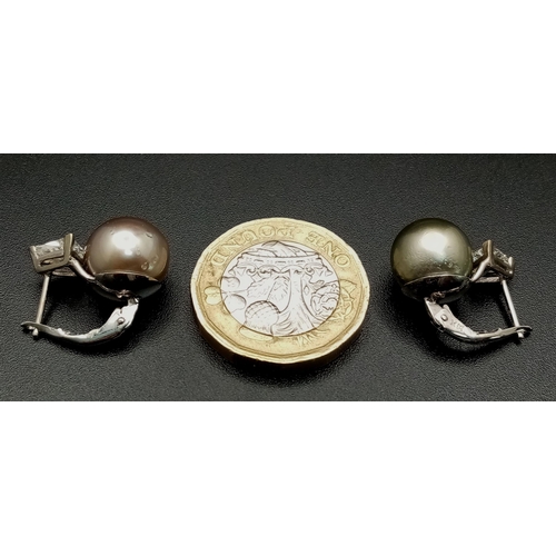 478 - A Pair of 14K White Gold, Tahitian Pearl and Trillion Cut Diamond Earrings. Lever-back clasp. 5.8g t... 