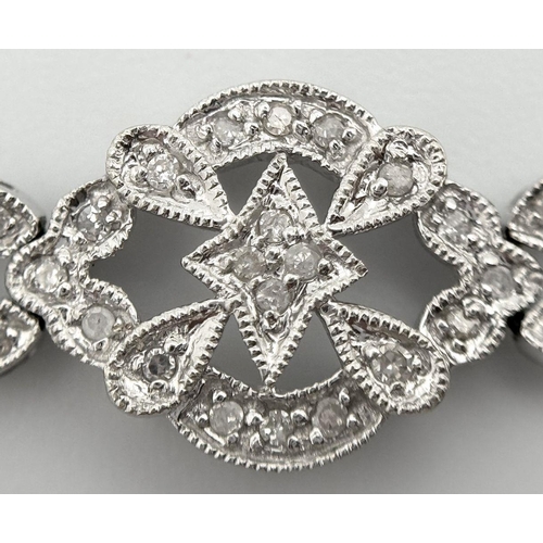 485 - An Art Deco Style 14K White Gold and Diamond Bracelet. 18cm. 10.9g. Five small stones missing so A/F... 