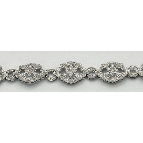 485 - An Art Deco Style 14K White Gold and Diamond Bracelet. 18cm. 10.9g. Five small stones missing so A/F... 