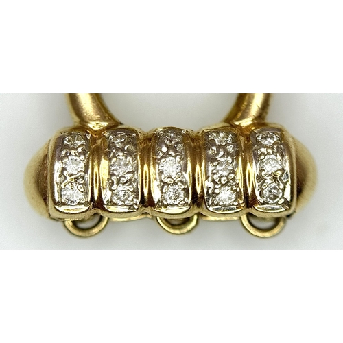 659 - An 18K Yellow Gold and Diamond Fancy Necklace Clasp. 0.40ctw diamonds. For a three row necklace. 5.8... 