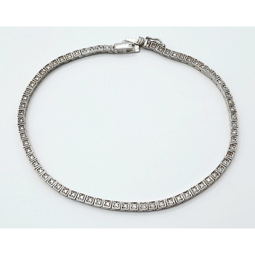 899 - A 14K White Gold Tennis Bracelet. 19cm. 8.6g total weight.