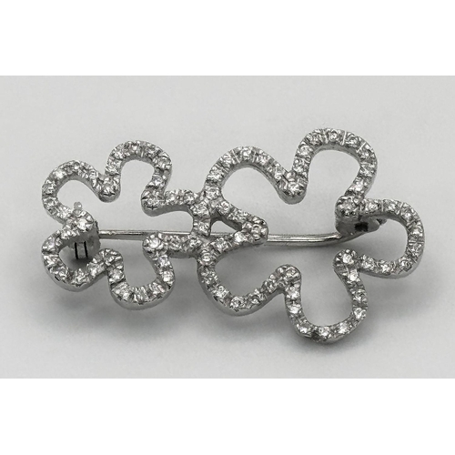 906 - An 18K White Gold and Diamond Brooch. Graduated encrusted stars. 3cm. 4.7g total weight.