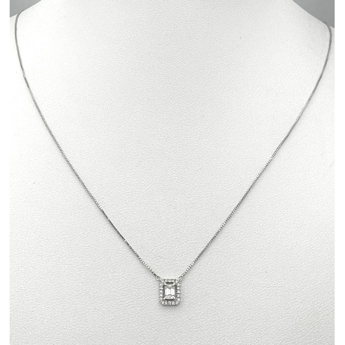 913 - An 18K Gold Emerald Cut Diamond Pendant on an 18K White Gold Disappearing Necklace. 7mm pendant. 44c... 