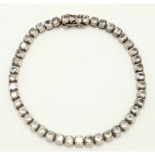 1392 - A Vintage Silver and Clear Stone Tennis Bracelet. 20cm Length. Bracelet width is 4mm. Gross weight 1... 