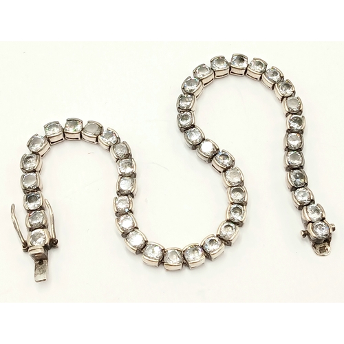 1392 - A Vintage Silver and Clear Stone Tennis Bracelet. 20cm Length. Bracelet width is 4mm. Gross weight 1... 