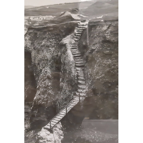 1562 - A framed black and white photograph with the view of an old mine from the cliffs at Perranporth from... 