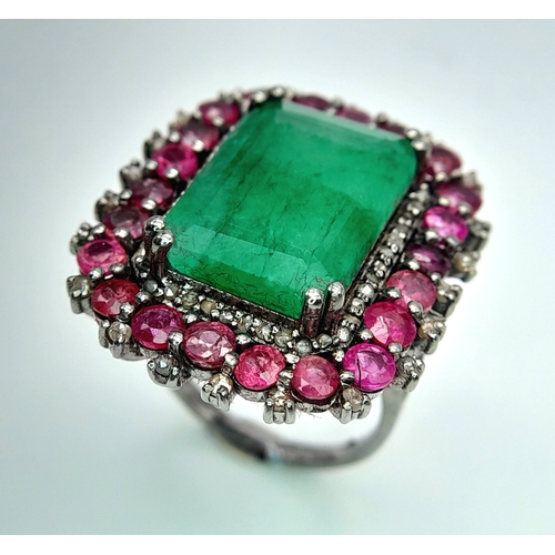 163 - An Emerald, Ruby and Diamond Dress Ring. Set in 925 Silver. Ruby weight 3ctw, emerald weight 10ct. D... 