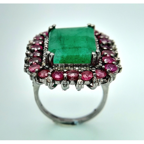 163 - An Emerald, Ruby and Diamond Dress Ring. Set in 925 Silver. Ruby weight 3ctw, emerald weight 10ct. D... 