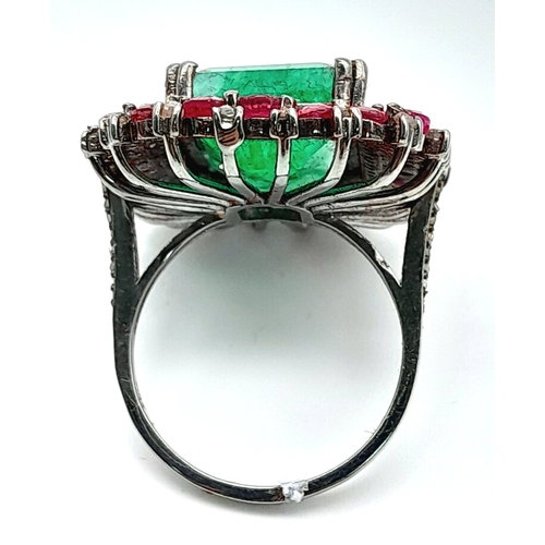 163 - An Emerald, Ruby and Diamond Dress Ring. Set in 925 Silver. Ruby weight 3ctw, emerald weight 10ct. D... 