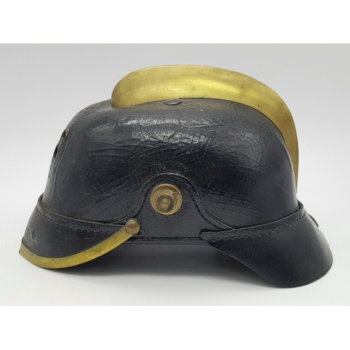 197 - An Unusual Imperial German Fire Helmet. A standard 1915 Pattern Army Pickelhaube Marked to the 19th ... 