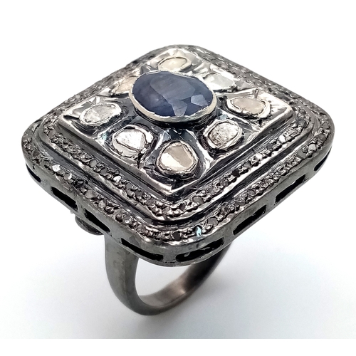 857 - An Antique Style Diamond and Blue Sapphire Dress Ring. Set in 925 Silver. 1.2ct sapphire. 2ctw of ol... 