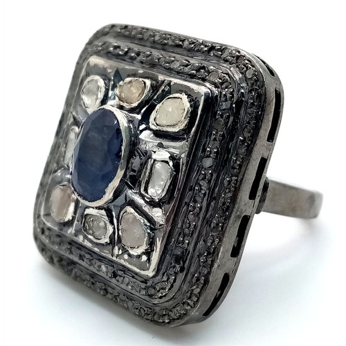 857 - An Antique Style Diamond and Blue Sapphire Dress Ring. Set in 925 Silver. 1.2ct sapphire. 2ctw of ol... 