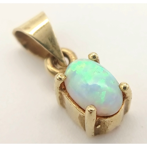 894 - A 9K YELLOW GOLD OPAL SET PENDANT 0.8G TOTAL WEIGHT, 0.5CM x 1CM. Ref: A/S 1208