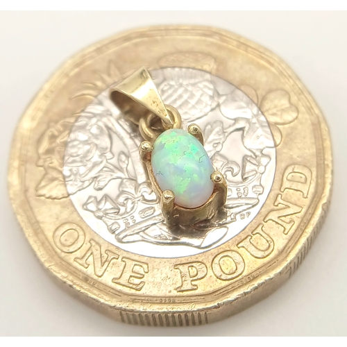 894 - A 9K YELLOW GOLD OPAL SET PENDANT 0.8G TOTAL WEIGHT, 0.5CM x 1CM. Ref: A/S 1208