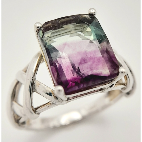 879 - An Unique Sterling Silver Celtic Design Flourite Set Love Ring Size P. The ring is set with a 1.2cm ... 