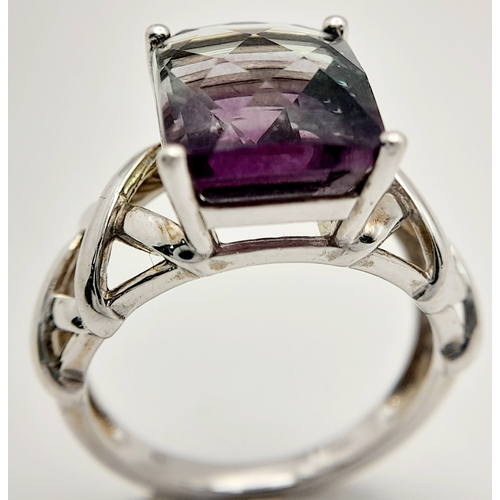 879 - An Unique Sterling Silver Celtic Design Flourite Set Love Ring Size P. The ring is set with a 1.2cm ... 