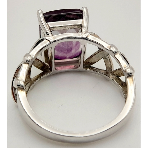 879 - An Unique Sterling Silver Celtic Design Flourite Set Love Ring Size P. The ring is set with a 1.2cm ... 