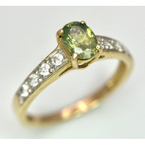 7 - Beautiful 9 CARAT GOLD and PERIDOT RING. Nicely set,having an oval cut PERIDOT mounted to top with W... 